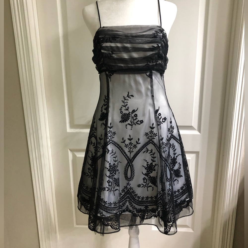 Gorgeous Dress with intricate details. Size M. Flattering and beautiful design.